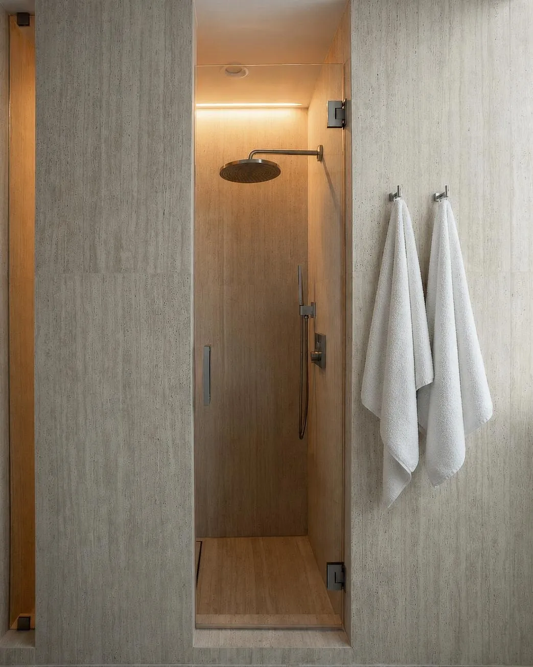Marquis 3301 shower by DALOP Design: a rain head over an oak bench with towels on brushed hooks